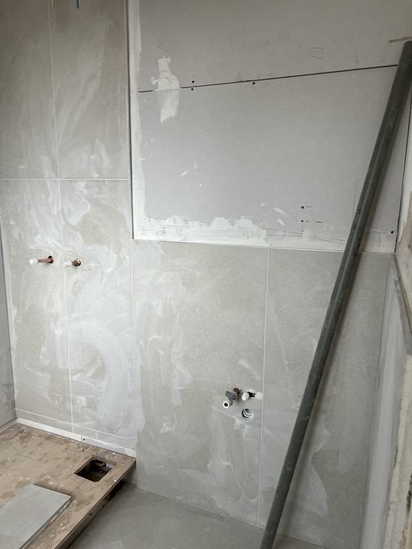 Bathroom walls boarded and prepared for tiling
